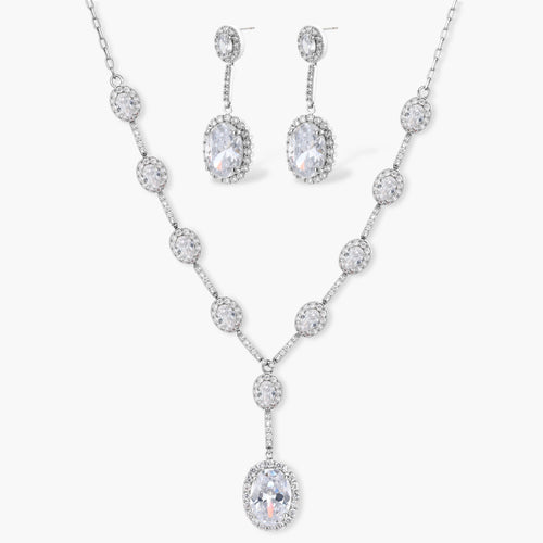 Elegant white gold plated jewelry set with oval cubic zirconia stones in halo settings, featuring Y-necklace and drop earrings.